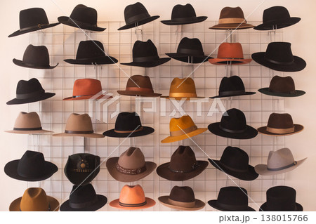 Large display wall of varied fedora and cowboy hats Large display wall of varied fedora and cowboy hats 138015766