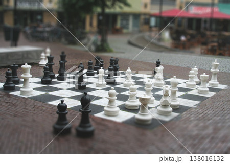 Outdoor giant chess set on a city square with tilt-shift effect 138016132