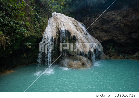 Beautiful view of Koh Luang Waterfall in Maeping National Park of Lamphun province, Thailand. It is a limestone waterfall with spectacular beauty. Beautiful view of Koh Luang Waterfall in Maeping National Park of Lamphun province, Thailand. It is a limestone waterfall with spectacular beauty. 138016718