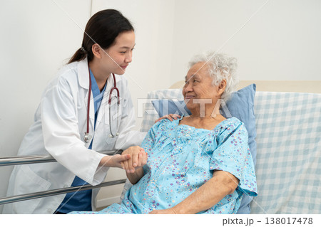 Asian doctor checking and treat elderly woman patient health in hospital. Asian doctor checking and treat elderly woman patient health in hospital. 138017478