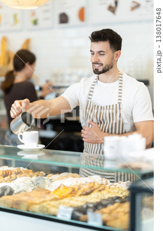 Male barista making cappuccino Male barista making cappuccino 138017648