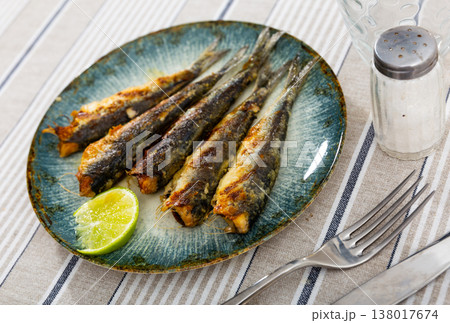 Grilled pilchards served with slice of lemon for dinner Grilled pilchards served with slice of lemon for dinner 138017674