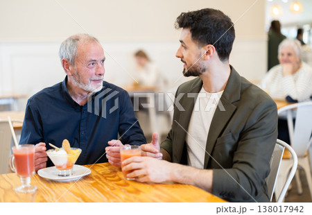Elderly man met with his adult son in a cafe Elderly man met with his adult son in a cafe 138017942