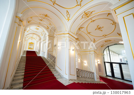 Internal staircase in palace, walls are decorated with gold-colored monograms in Bratislava castle 138017963
