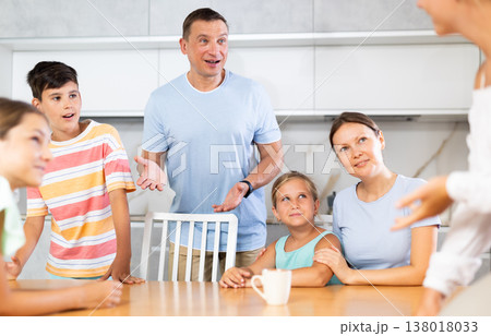 Children and parents communicate together in the home kitchen - the joy of large family Children and parents communicate together in the home kitchen - the joy of large family 138018033