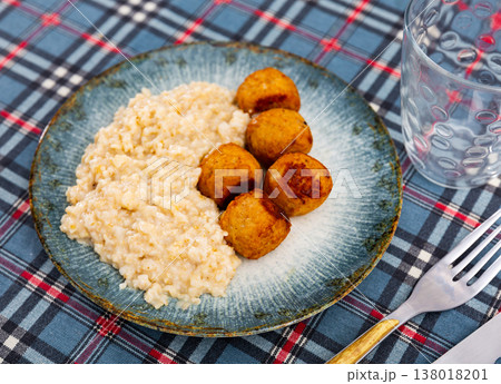 Delicious smoked spanish albondigas, meatballs cooked with oatmeal closeup Delicious smoked spanish albondigas, meatballs cooked with oatmeal closeup 138018201