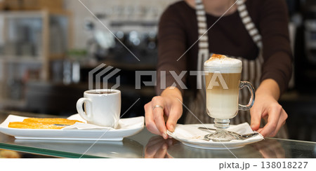 Female barista made delicious coffee Female barista made delicious coffee 138018227
