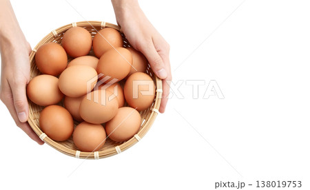 A person showcases a basket overflowing with brown eggs for National Egg Month 138019753