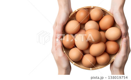 A person presents a basket of brown eggs, in recognition of National Egg Month 138019754