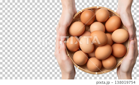 A person presents a basket of brown eggs, in recognition of National Egg Month 138019754
