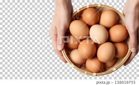 A hand grips a basket brimming with brown eggs, highlighting National Egg Month A hand grips a basket brimming with brown eggs, highlighting National Egg Month 138019755