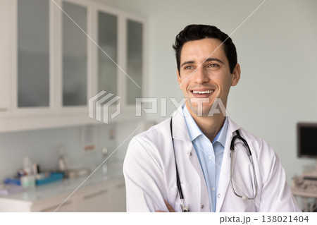 Doctor looks into distance with optimistic expression Doctor looks into distance with optimistic expression 138021404