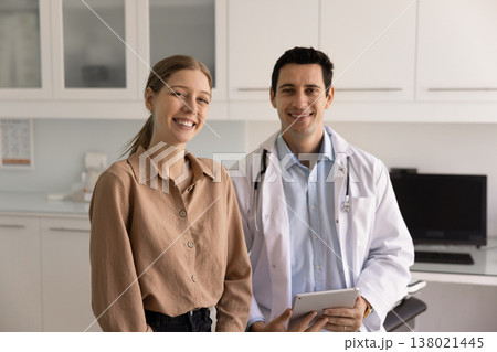 Portrait of female patient and male doctor posing in clinic 138021445