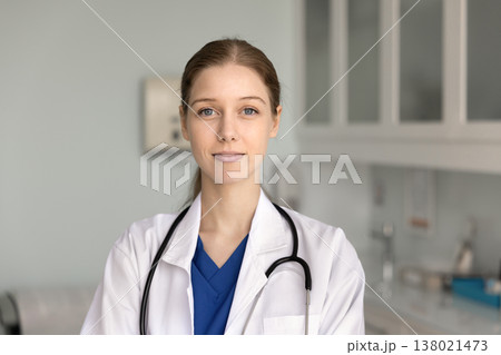 Head shot close-up portrait of happy woman nurse or intern Head shot close-up portrait of happy woman nurse or intern 138021473