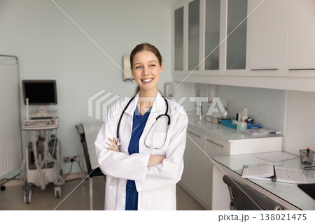 Sonographer or radiologist professional looking away with contented smile 138021475