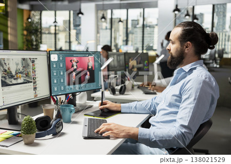 Male worker using AI generative models for text to image editorial materials, virtual assistant writing script for photography generating next to video streaming platform on dual monitors. 138021529