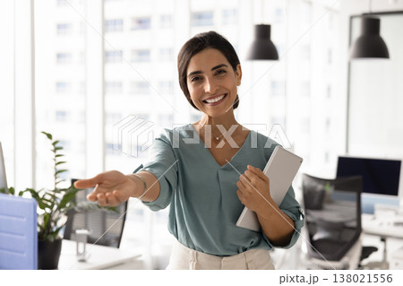 Friendly Latina woman recruiter inviting you to start office career Friendly Latina woman recruiter inviting you to start office career 138021556