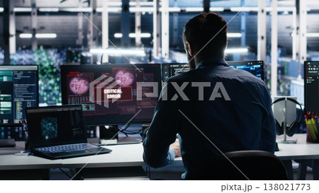 Annoyed data center programmer struggles with malfunctions while using AI tools. Frustrated server hub worker upset by errors while using artificial intelligence to optimize system health, camera A 138021773