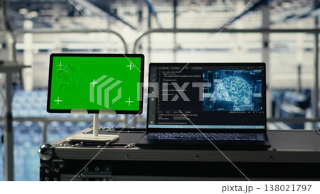 Mockup device in data center with supercomputers gear built for artificial intelligence prediction models. Green screen tablet in server room with neural networks tech detecting data patterns 138021797