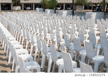 Large scale seating setup with many chairs prepared for an audience in a big event or conference environment. Large scale seating setup with many chairs prepared for an audience in a big event or conference environment. 138022275