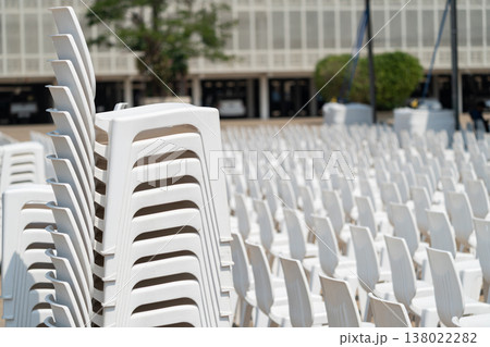 Large scale seating setup with many chairs prepared for an audience in a big event or conference environment. 138022282