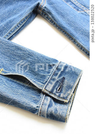 sleeve of blue denim shirt texture isolated on white background, jean fashion style 138022520
