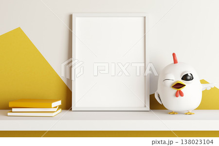 Empty blank photo frame with books and chicken doll on hanging shelf in white and yellow wall room. 138023104