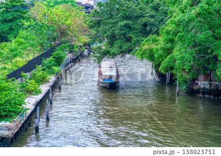 Canal Boat Traveling Through Bangkok Waterway Canal Boat Traveling Through Bangkok Waterway 138023751
