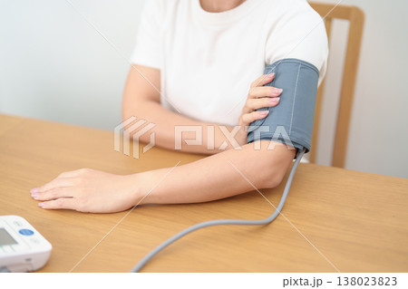 woman checking Blood pressure by Blood pressure monitor with Cuff. Systolic, SYS, Diastolic, DIA, Pulse, Hypertension, Hypotension, Heart rate, Cardiovascular Disease and May World hypertension day woman checking Blood pressure by Blood pressure monitor with Cuff. Systolic, SYS, Diastolic, DIA, Pulse, Hypertension, Hypotension, Heart rate, Cardiovascular Disease and May World hypertension day 138023823