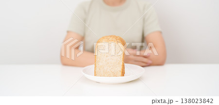 Happy smiling woman with whole wheat bread. Weight loss management, Dieting, Healthy eating, Calorie control, Fitness food, High fiber, Wellness, Lifestyle, Metabolism and Glycemic Index 138023842