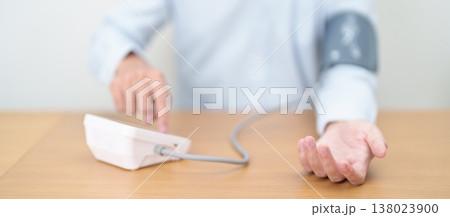 Man checking Blood pressure by Blood pressure monitor with Cuff. Systolic, SYS, Diastolic, DIA, Pulse, Hypertension, Hypotension, Heart rate, Cardiovascular Disease and May World hypertension day Man checking Blood pressure by Blood pressure monitor with Cuff. Systolic, SYS, Diastolic, DIA, Pulse, Hypertension, Hypotension, Heart rate, Cardiovascular Disease and May World hypertension day 138023900