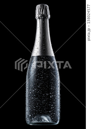 Champagne bottle with rising bubbles and silver foil on black backdrop with clipping path, symbolizing celebration and elegance 138024577