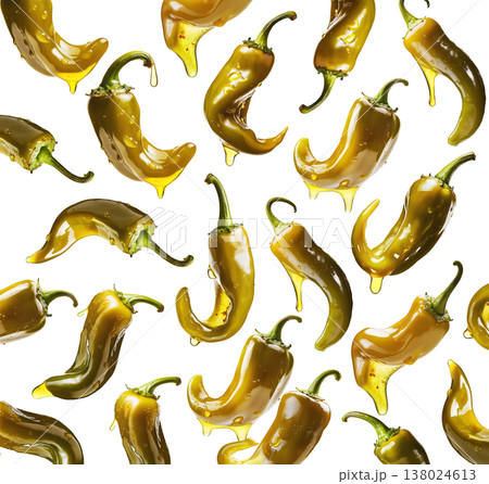 Shiny green chili peppers covered in oil, isolated on white background, emphasizing food freshness and culinary splash concept Shiny green chili peppers covered in oil, isolated on white background, emphasizing food freshness and culinary splash concept 138024613