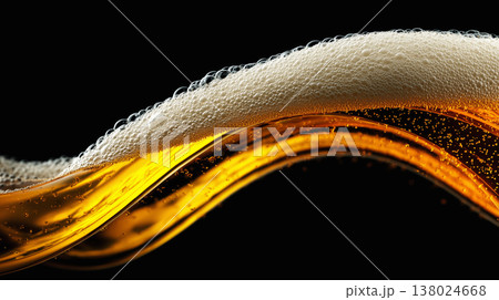 Golden foamy liquid splash and golden beer wave with frothy bubbles on dark background, concept of freshness, energy and vitality 138024668