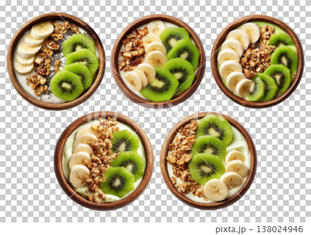 Wooden bowl filled with yogurt or smoothie, sliced kiwi, banana, granola, chia seeds, and fresh mint leaves Wooden bowl filled with yogurt or smoothie, sliced kiwi, banana, granola, chia seeds, and fresh mint leaves 138024946