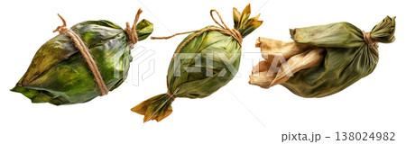 Venezuelan tamales wrapped in corn husk, tied with rustic rope, isolated on white background, representing South American cuisine Venezuelan tamales wrapped in corn husk, tied with rustic rope, isolated on white background, representing South American cuisine 138024982