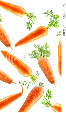 Bunches of fresh orange carrots with green tops arranged in a scattered layout isolated on white background, organic healthy food 138024989