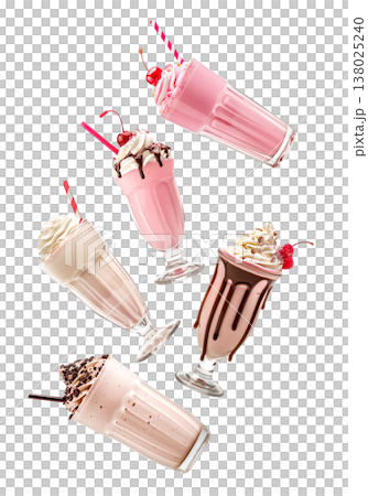 Multiple milkshakes with whipped cream shown isolated on white background, concept of sweet dessert treats 138025240