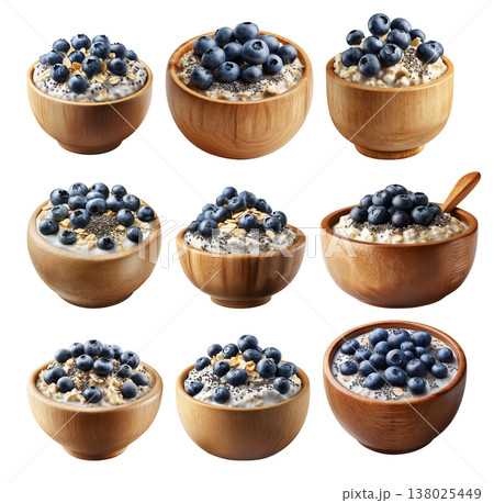 Wooden bowl filled with creamy oatmeal topped with fresh blueberries and chia seeds, isolated on white transparent background 138025449
