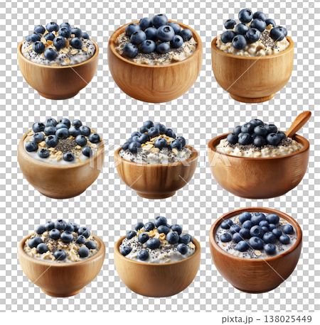 Wooden bowl filled with creamy oatmeal topped with fresh blueberries and chia seeds, isolated on white transparent background 138025449