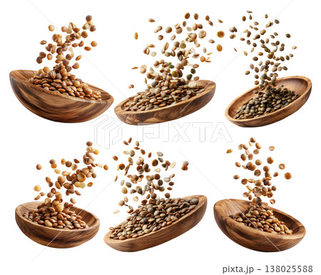Brown lentils flying from natural wooden bowl, isolated on white transparent background, concept of healthy eating 138025588