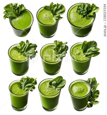 Fresh green smoothie in glass surrounded by lettuce, cucumber, spinach, and apple, isolated on white background 138025594
