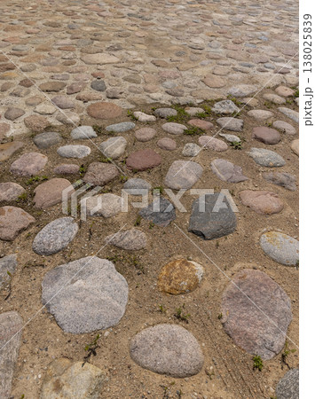 a road made of stones of different sizes in rural areas, a reconstructed ancient road made of multicolored stones and pebbles a road made of stones of different sizes in rural areas, a reconstructed ancient road made of multicolored stones and pebbles 138025839
