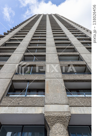 Upward view of modern high rise concrete apartment building exterior 138026456