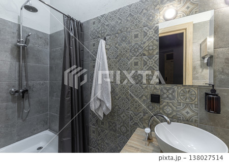 Modern Hostel Bathroom with Shower Stall and White Vessel Sink Modern Hostel Bathroom with Shower Stall and White Vessel Sink 138027514