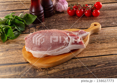 Raw pork steak over board Raw pork steak over board 138027773