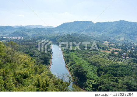Winding River Flowing Through Lush Green Valley 138028294