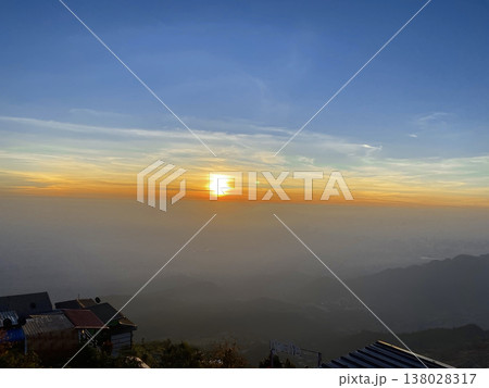 Golden sunset above misty valley 138028317