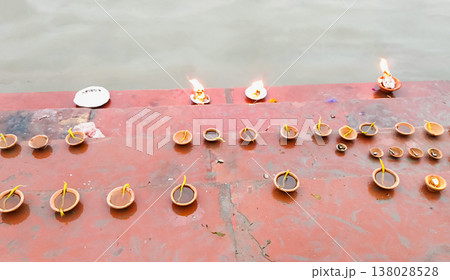 Clay Oil Lamps (Diyas) on Ghat Steps Near Yamuna River 138028528