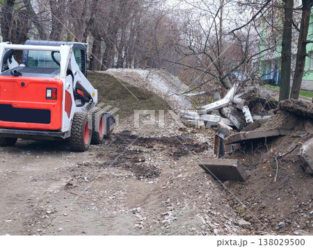 Gravel stacks on repair road.Load bucket of construction bulldozer 138029500